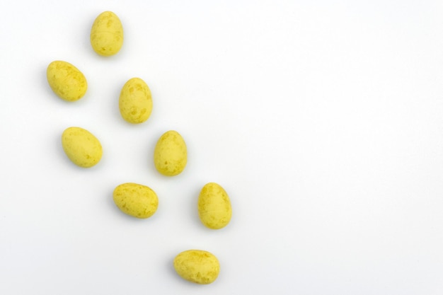 Yellow Easter eggs on a white background Copy space