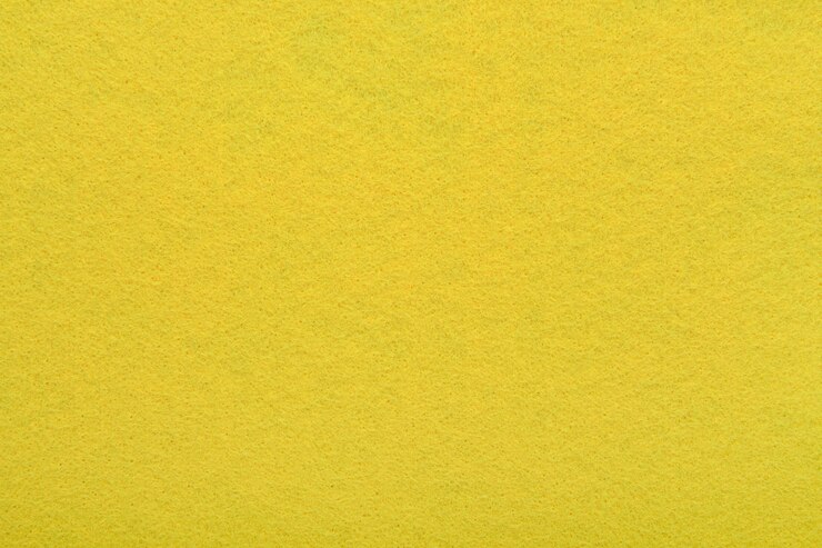 Yellow felt texture background closeup of soft fabric surface Seamless background graphic
