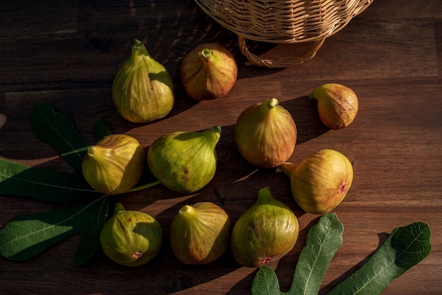 A yellow figs on an brown wooden background