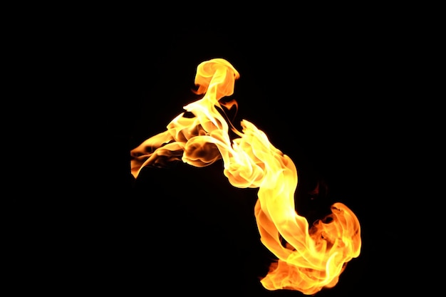 Photo yellow fire flames isolated on a black background