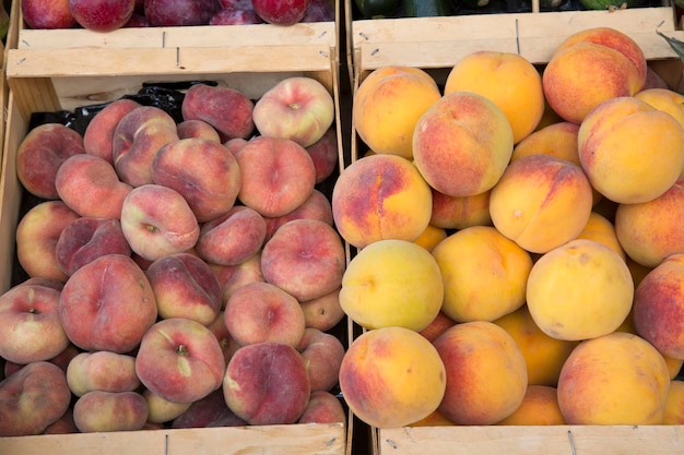 Yellow and Flat Peaches on Market