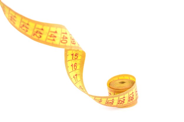 Yellow flexible porn centimeter for measurements on a white background