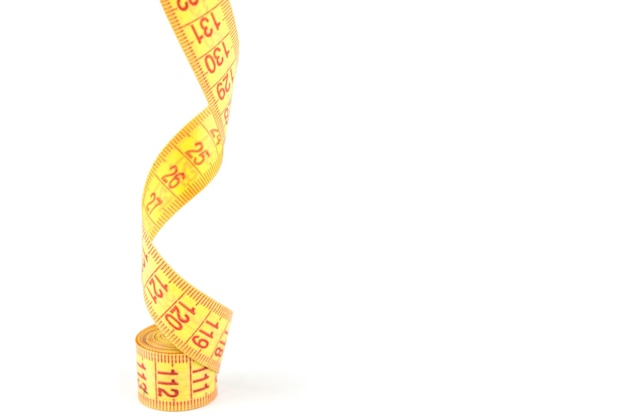 Yellow flexible porn centimeter for measurements on a white background