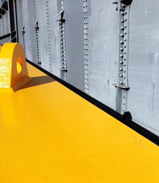 Yellow floor by metallic wall