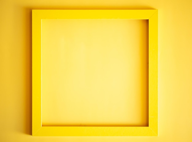 Yellow frame with blank yellow sticker for notes on yellow background