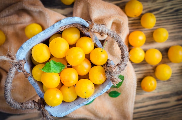 Yellow fresh cherry plum on the table