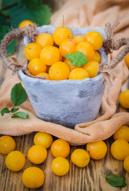 Yellow fresh cherry plum on the table