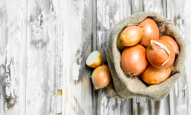 Yellow fresh onion in sack