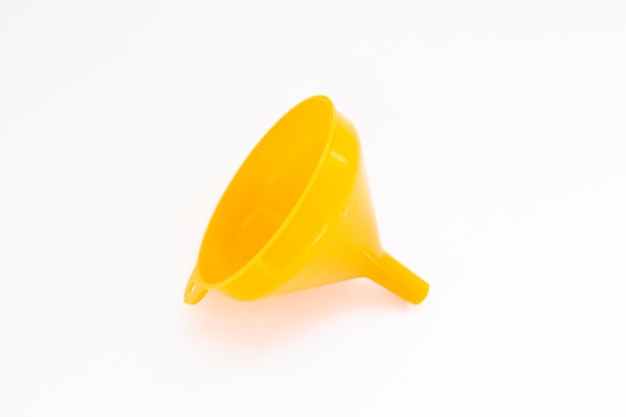 A yellow funnel is on a white background with a white background.