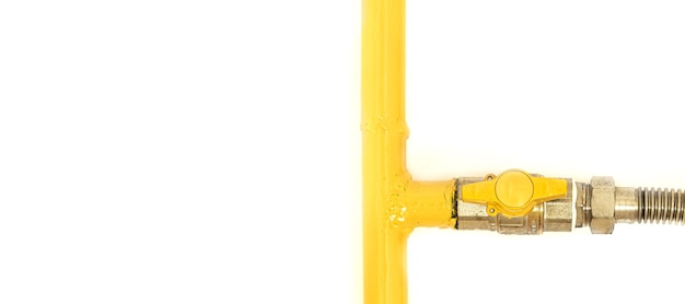 Yellow gas pipe with a valve. White background. Space for text.