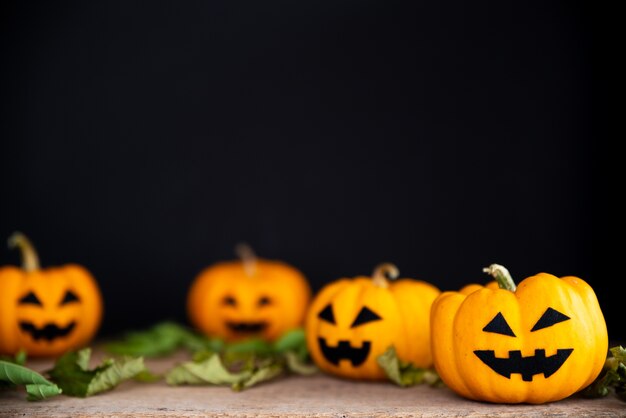 Yellow ghost pumpkin on black background. halloween concept. 