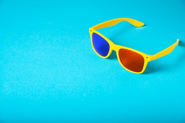 Yellow glasses isolated on blue. 3D glasses