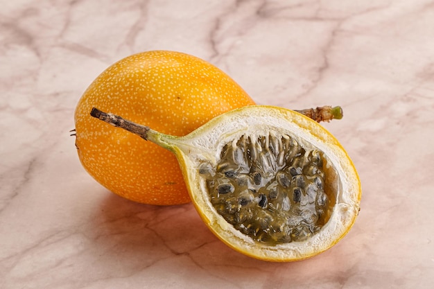 Yellow granadilla with cut half