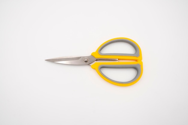 Yellow grey handle scissors isolate on white background Paper art multipurpose cutting