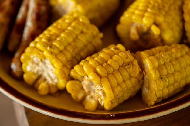 yellow grilled pieces of corn in the plate