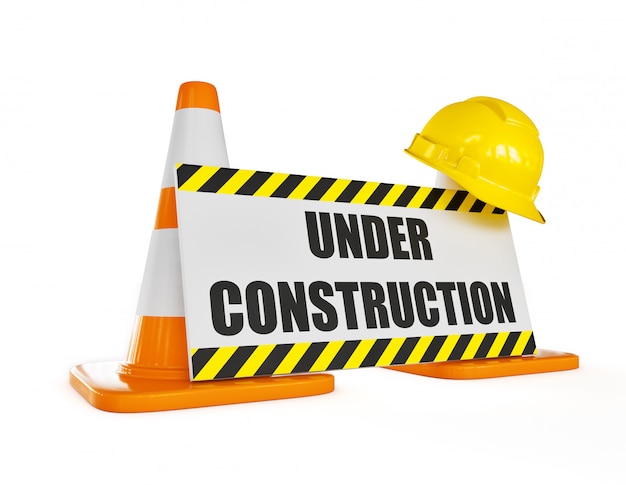 Photo yellow hard hat on orange highway traffic construction cone with under construction sign