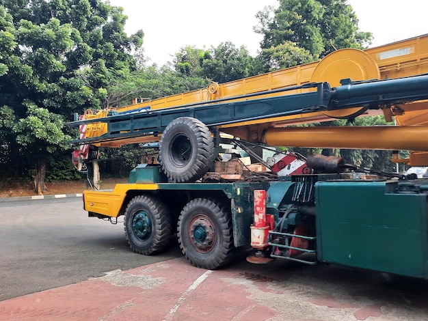 Yellow heavy duty mobile crane on road