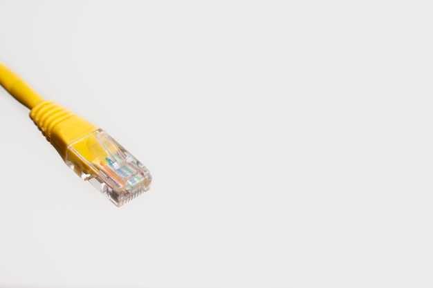 Yellow internet LAN cable isolated on white background.