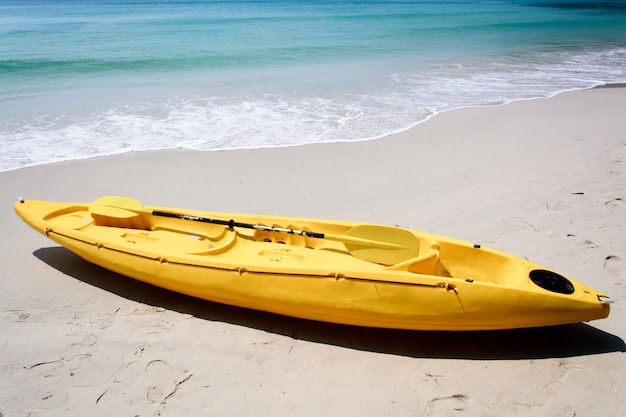 Yellow kayak on the beach