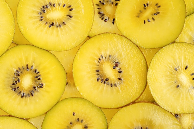 Yellow kiwi fruit pattern Healthy food background overhead