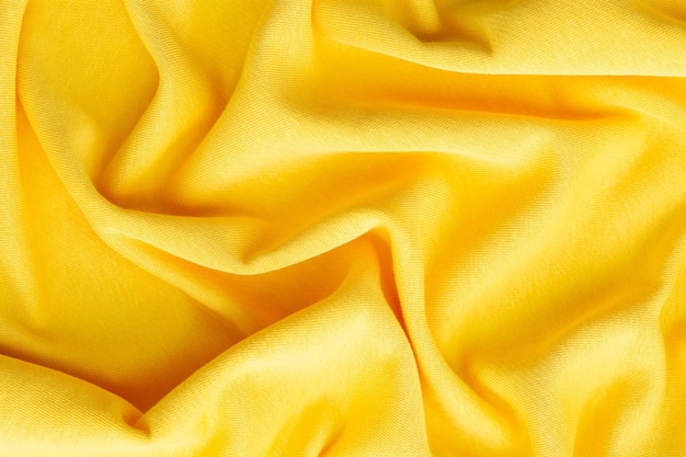 Yellow knitted fabric textured background