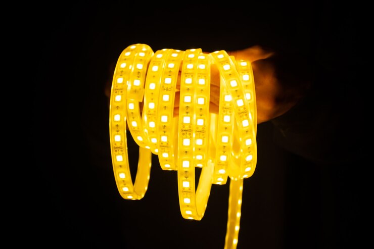 Photo yellow led strip in hand for lighting.