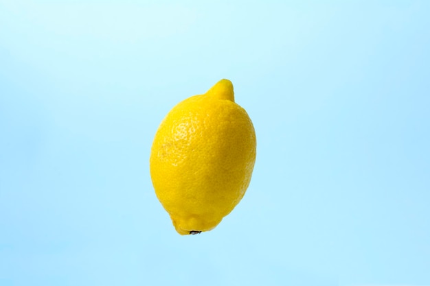 yellow lemon close up on a blue background