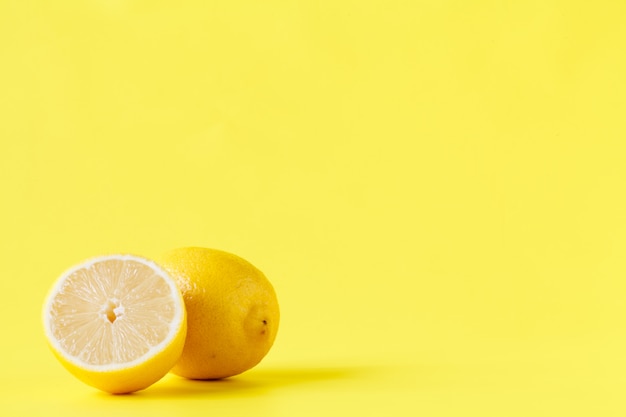 Yellow lemon cutted half on table with pattern