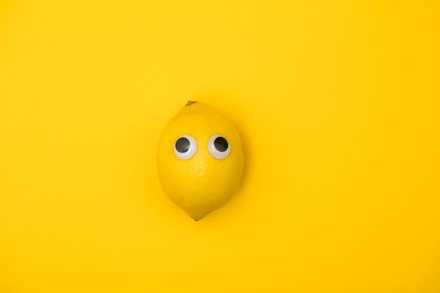 Yellow lemon face with comedy googly eyes