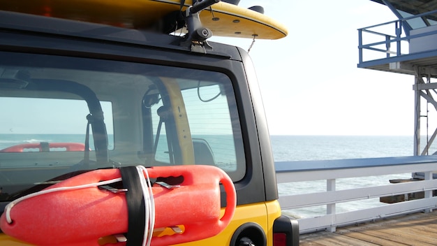 Yellow lifeguard car ocean beach california usa rescue pick up truck lifesavers vehicle