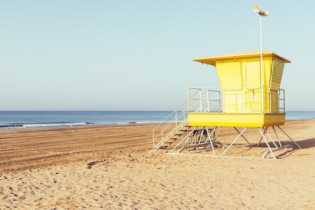 Yellow lifeguard station on the beach