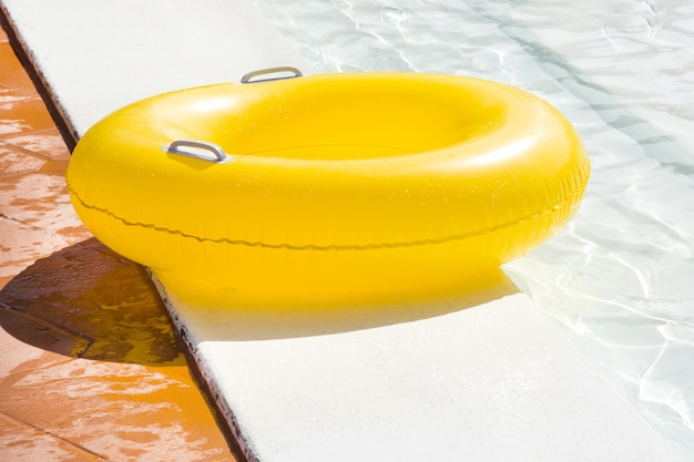 Yellow lifeline next to a pool