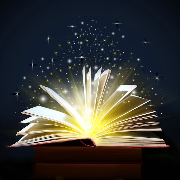 Yellow lights and sparkles coming from an open book