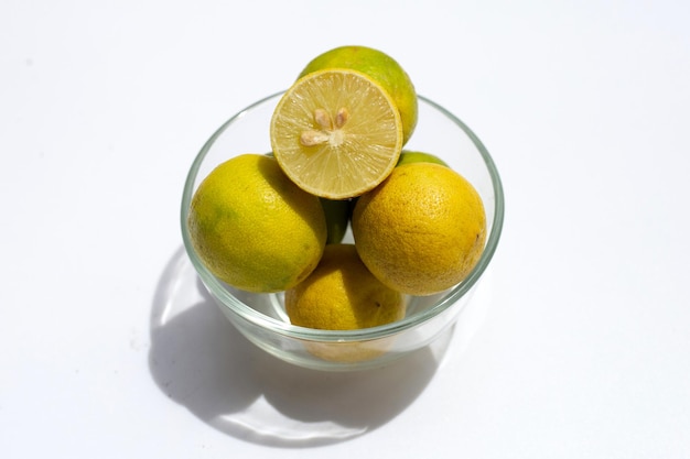 Yellow limes in glass bowl