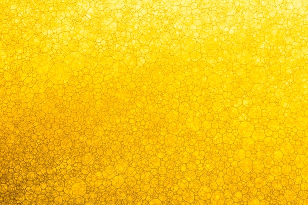 黄色の液体表面ロシアの食用油ハニーテクスチャードフルフレーム