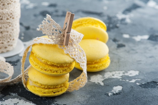 Yellow macarons with pins