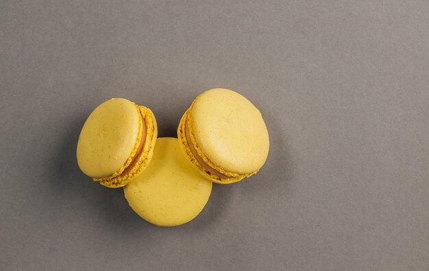 Yellow macaroons on gray