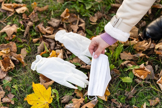 yellow maple leaves and a medical mask. concept, protect yourself from coronavirus