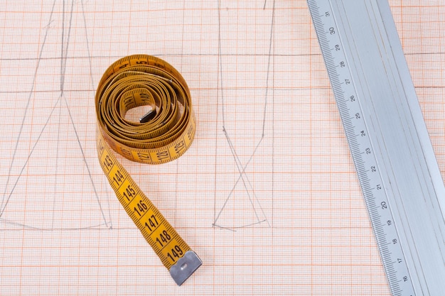 Yellow measure tape and metal ruler