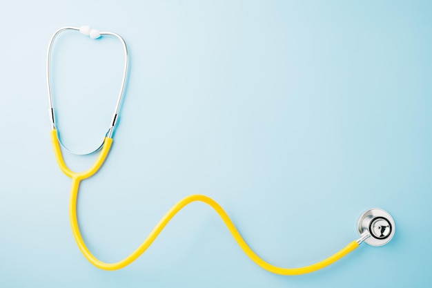 Yellow medical stethoscope isolated