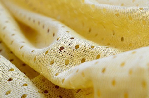 Modello giallo del fondo del tessuto del tessuto di usura di sport della maglia
