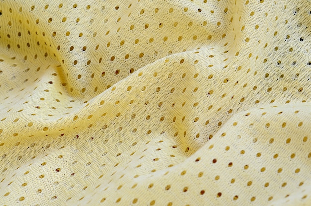 Yellow mesh sport wear fabric textile background 