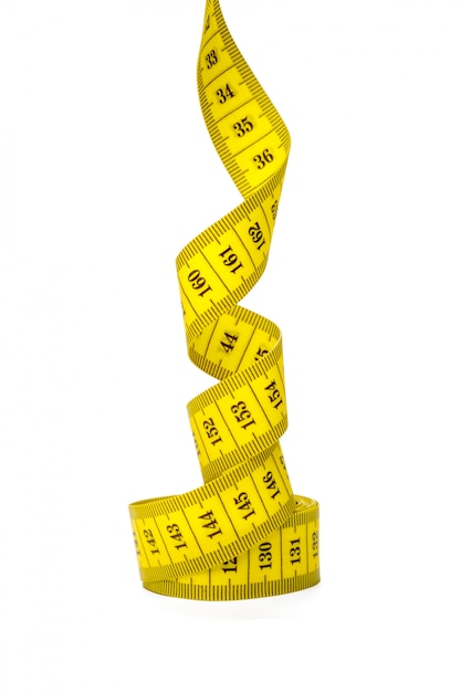 Yellow metric measuring tape isolated on white panorama background