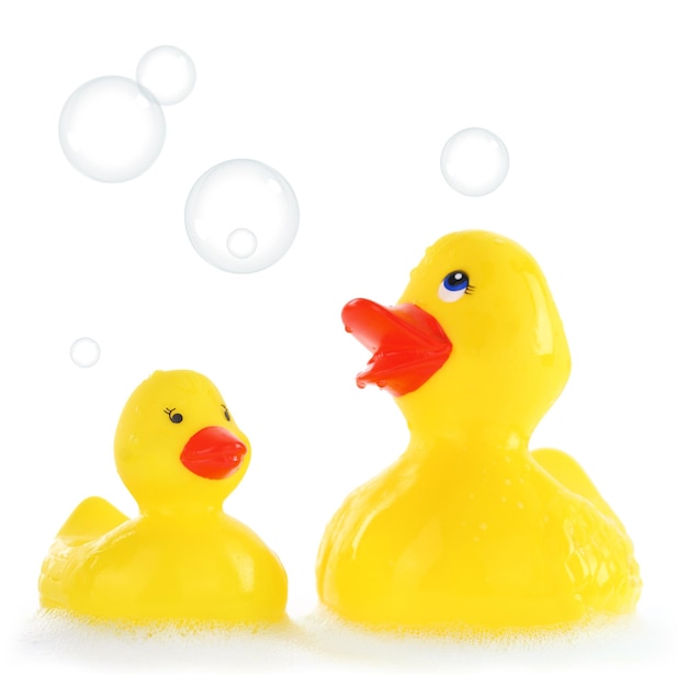 Yellow mother and child rubber ducks in bath foam