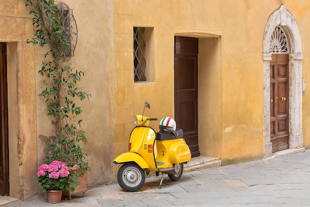 Yellow motorcycle on the Italian street Tuscany