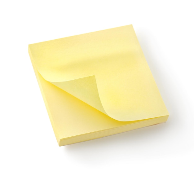 白い背景に分離された黄色のノートブック。クリッピングパス