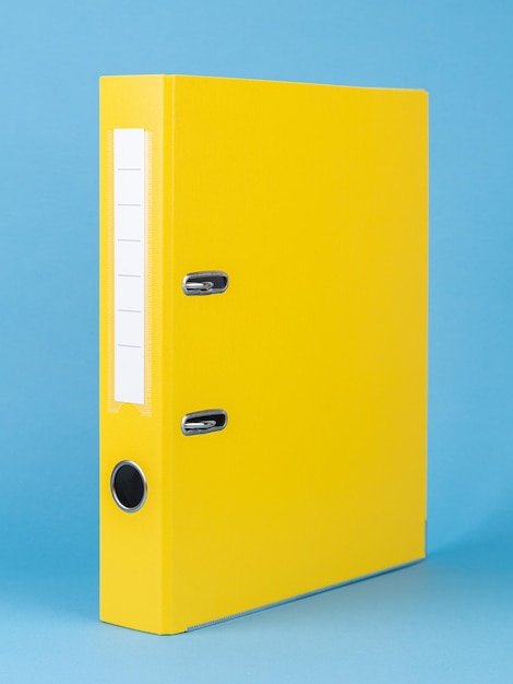 yellow office folders isolated on the blue background