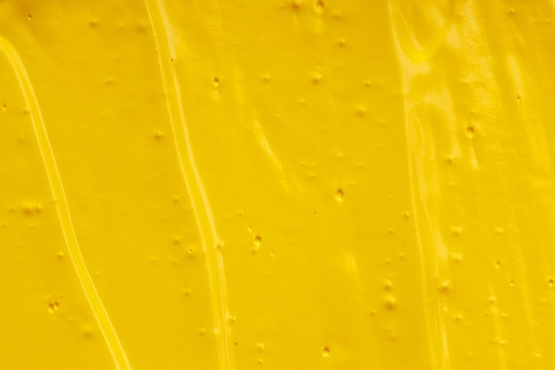 Yellow oil paint. background for designer