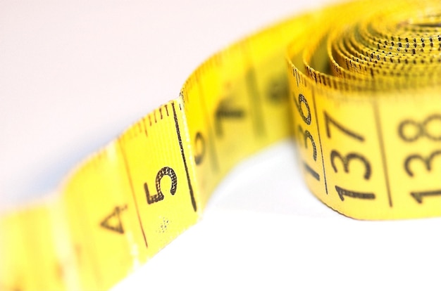 yellow old tailor scoop on white isolated background