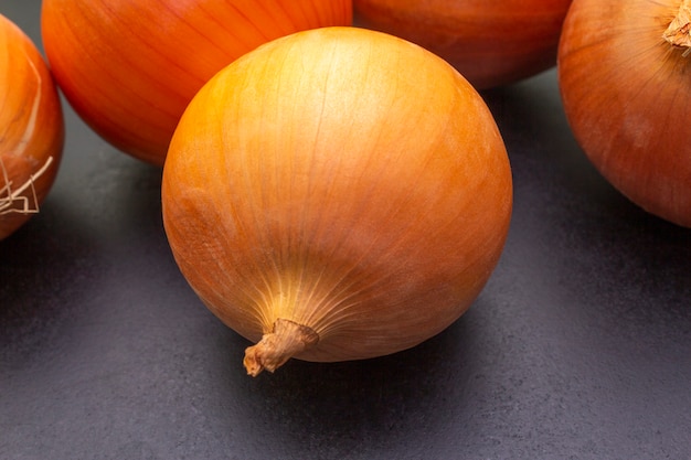 Yellow onion on black surface